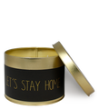Geurkaars goud en zwart met de tekst Let's stay Home welke openstaat