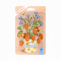 losse thee in een zakje met bloemen erop en de tekst je bent een topper