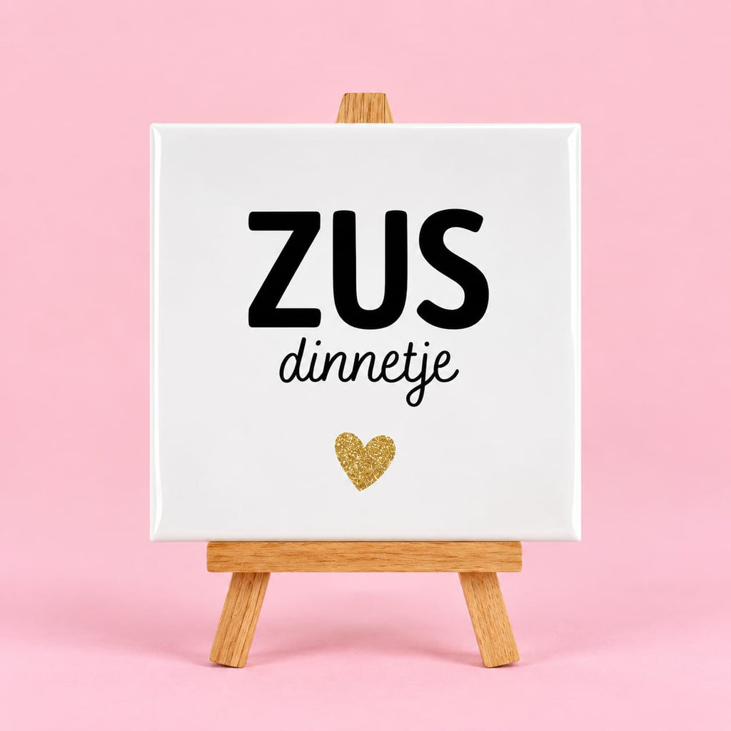 Witte keramieken tegel met de tekst zusdinnetje
